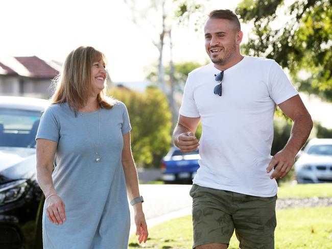 Josh Reynolds with his mum Nicole after Police dropped domestic violence charges. Picture: Jonathan Ng