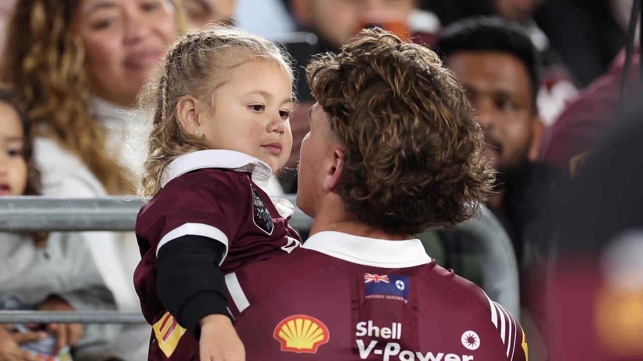 SYDNEY, AUSTRALIA - JUNE 05: Reece Walsh of the Maroons is seen with his daughter on the side-line during game one of the 2024 Men's State of Origin Series between New South Wales Blues and Queensland Maroons at Accor Stadium on June 05, 2024 in Sydney, Australia. (Photo by Cameron Spencer/Getty Images)