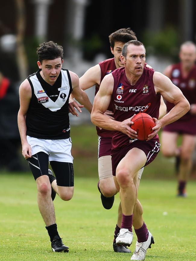 Tim Sanders bursts from the contest against the Blacks. Picture: AAP/Mark Brake