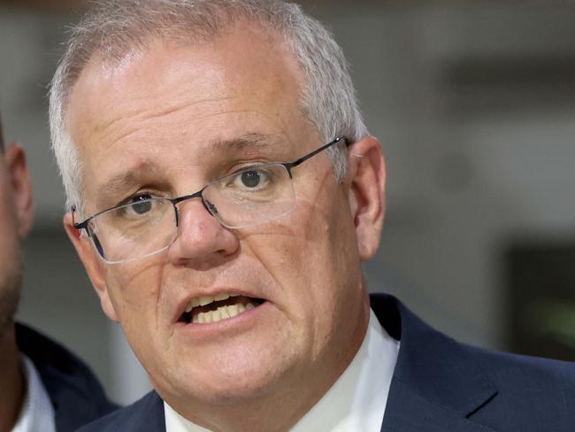 DAILY TELEGRAPH, APRIL 06, 2022: Prime minister Scott Morrison pictured speaking to media on his visit to NuPress in Cardiff In Newcastle with local candidates James Thomson (National candidate for the seat of Hunter) and Nell McGill Liberal candidate for Shortland.Picture: Damian Shaw