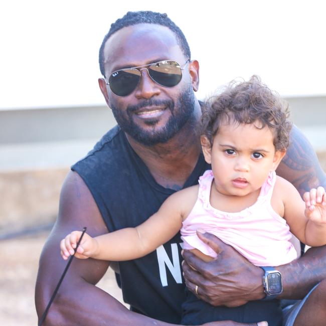 Michael Pulu and his daughter Octavia, 21 months, enjoying day one of the Royal Darwin Show. Picture: Glenn Campbell