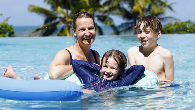 Tourism Tropical North Queensland is encouraging more tourists to visit the Far North in Summer, typically a quiet time of the year with rain and high temperatures deterring visitors. Sydney tourists Suzie Blackwell enjoys a swim in the resort pool at Vue Trinity Beach with her daughter Ruby Blackwell, 6, and her nephew Tim Blackwell, 9. Picture: Brendan Radke