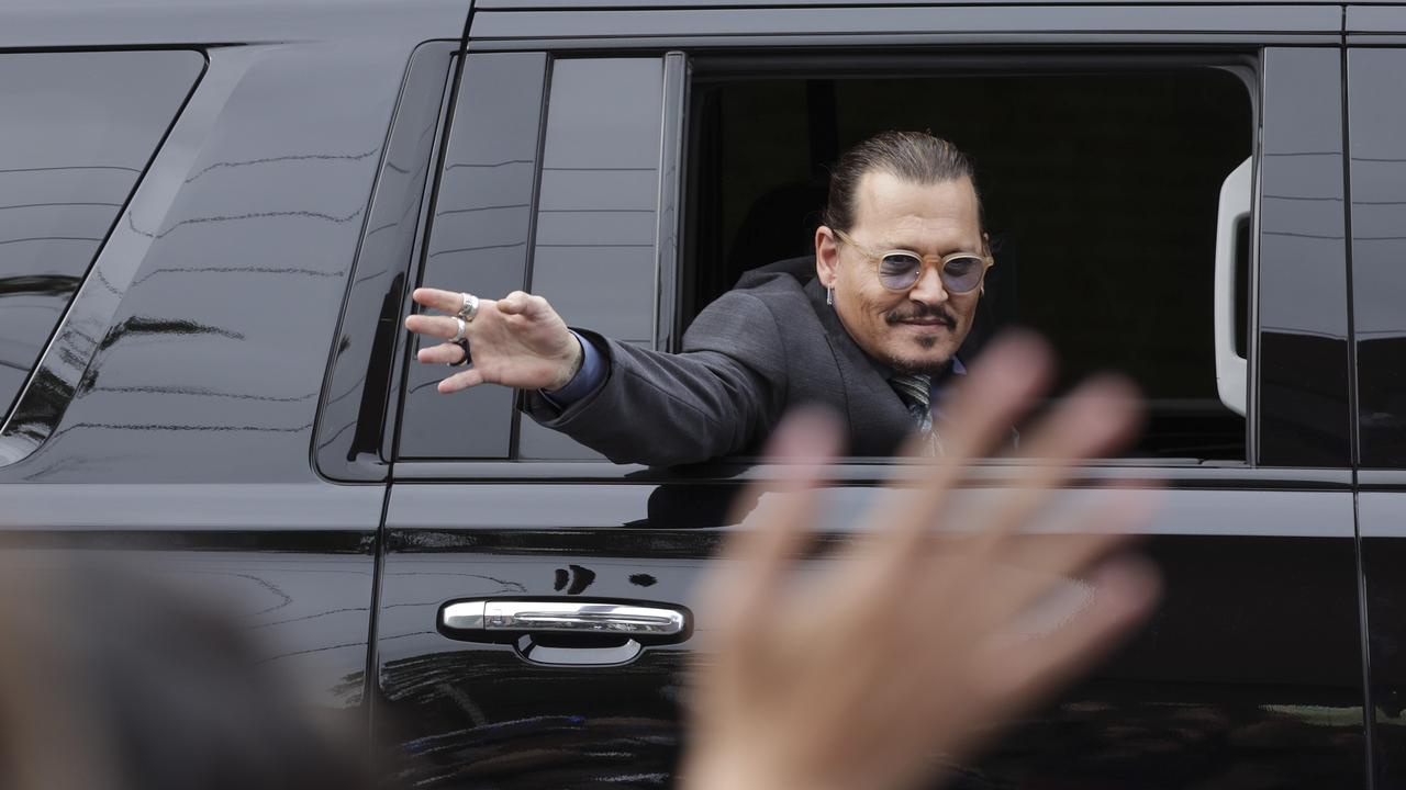 Johnny Depp waves to supporters as he leaves Virginia’s Fairfax County Courthouse. Picture: Kevin Dietsch/Getty Images/AFP