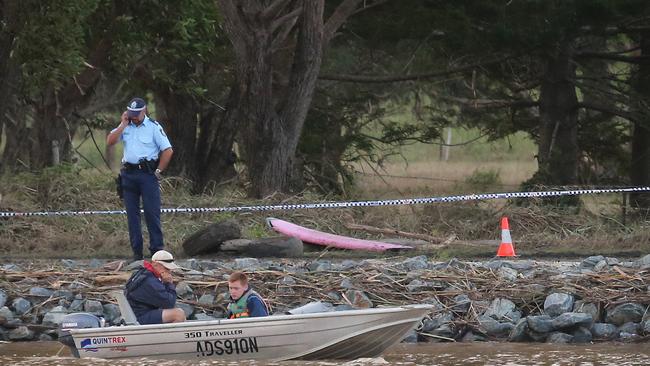 Three dead in Tweed River tragedy. Matt Grinham and son Thomas, 15, used a depth sounder to locate the car in the river at Tumbulgum. Picture: Glenn Hampson