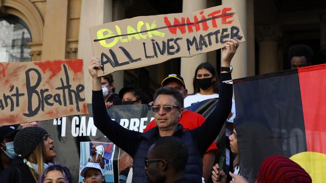 A man sparked outrage after holding up an “all lives matter” sign. Picture: Matrix