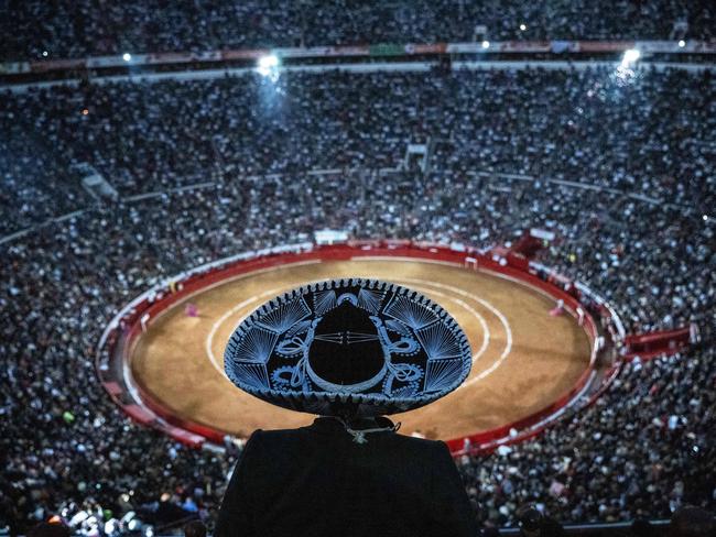 A spectator in a traditional mariachi hat watches a bullfight at Mexico City’s Monumental Plaza de Toros, following the Supreme Court’s reversal of a suspension on the sport. Picture: Carl de Souza/AFP