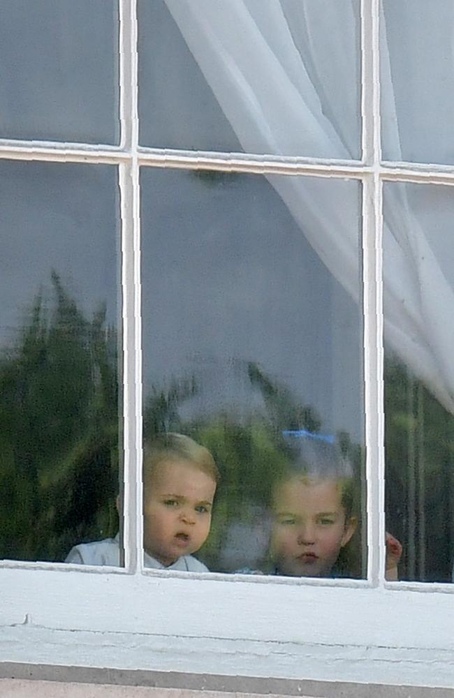 Prince Louis and Princess Charlotte in Buckingham Palace. Picture: AFP