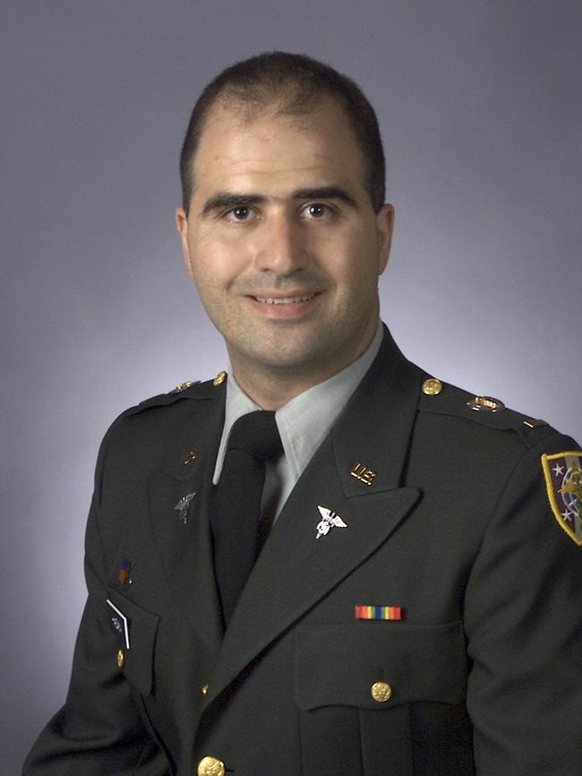 This 2003 picture provided by the Uniformed Services University of the Health Sciences shows Nidal Malik Hasan in his graduation photo after he completed his M.D. degree.