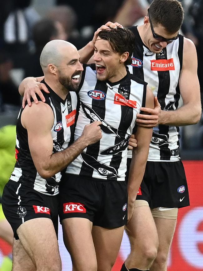 Patrick Lipinski is congratulated by teammates after kicking a goal. Picture: Quinn Rooney/Getty Images