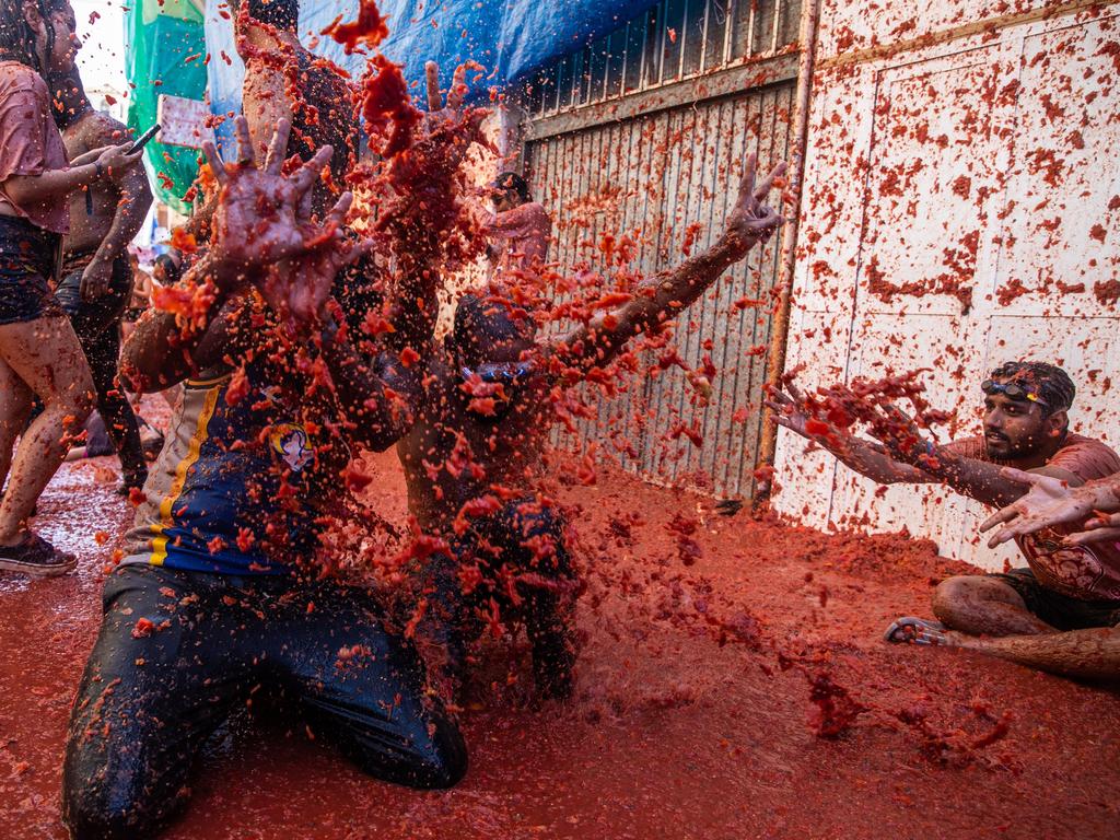 After a two-year absence due to the Covid pandemic, thousands of tourists returned to the usually sleepy Spanish town of Buñol to throw tomatoes at each other as they participate in the annual Tomatina festival on August 31. Picture: Zowy Voeten/Getty Images