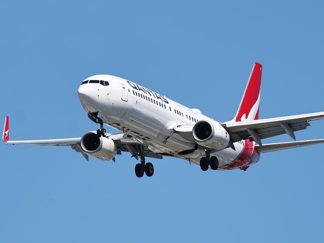 A Qantas commercial passenger jet plane comes into land at the Cairns International Airport, increasing tourism numbers in Far North Queensland. Picture: Brendan Radke