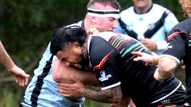 Jake Elphick being tackled by Mikaere Beattie. Group 2 Rugby League, 2025 round six. Sawtell Panthers v Woolgoolga Seahorses at Rex Hardaker Oval, June 1 2025. Picture: Leigh Jensen