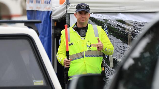 Police patrol the border between NSW and Queensland. More than 600,000 Sydney residents are now banned from entering the state. Picture: Adam Head