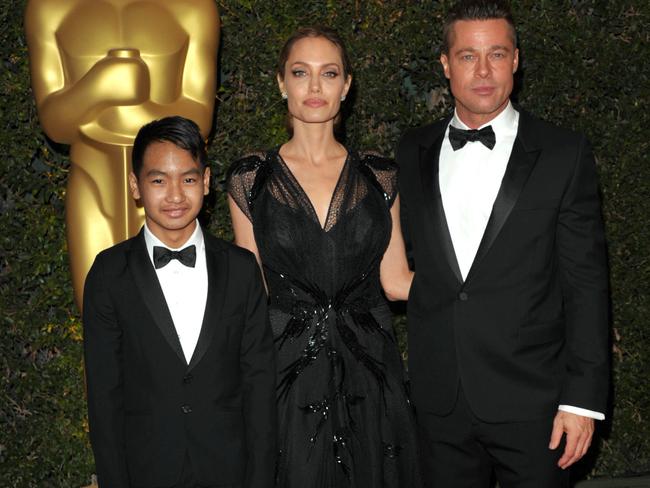 Maddox Jolie-Pitt, from left, Angelina Jolie and Brad Pitt, in 2013.