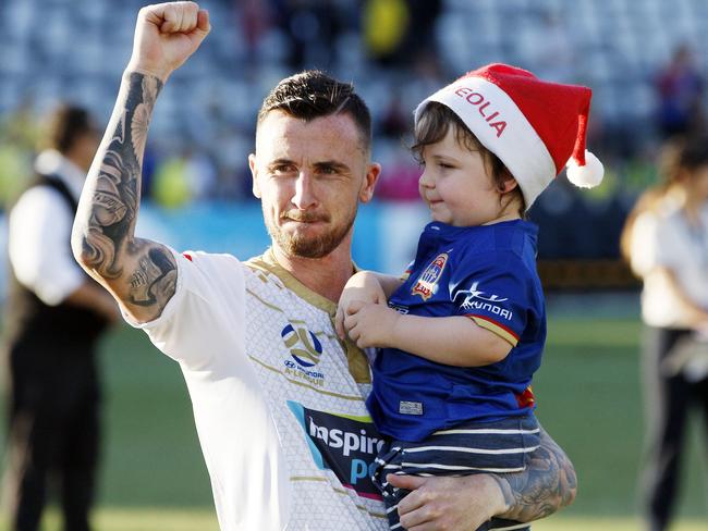 Roy O'Donovan of the Jets celebrates the win with Alfie after the Round 9 A-League match between the Central Coast Mariners and the Newcastle Jets at Central Coast Stadium in Gosford, Sunday, December 23, 2018. (AAP Image/Darren Pateman) NO ARCHIVING, EDITORIAL USE ONLY