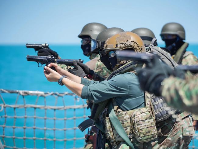 Romanian navy special forces take part in a shooting drill on the "King Ferdinand" frigate during NATO’s "Shield Protector" military exercise. Picture: AFP