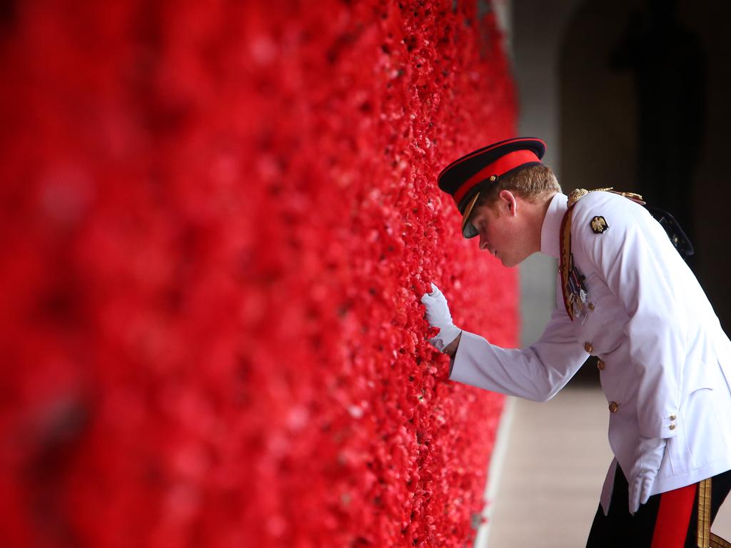 <b>2015:</b> At the height of his popularity, Prince Harry visits Australia for a four-week placement with the Australian Defence Force. After laying a wreath at the Tomb of the Unknown Australian Soldier in Canberra, he officially reports for duty. Picture: Kym Smith