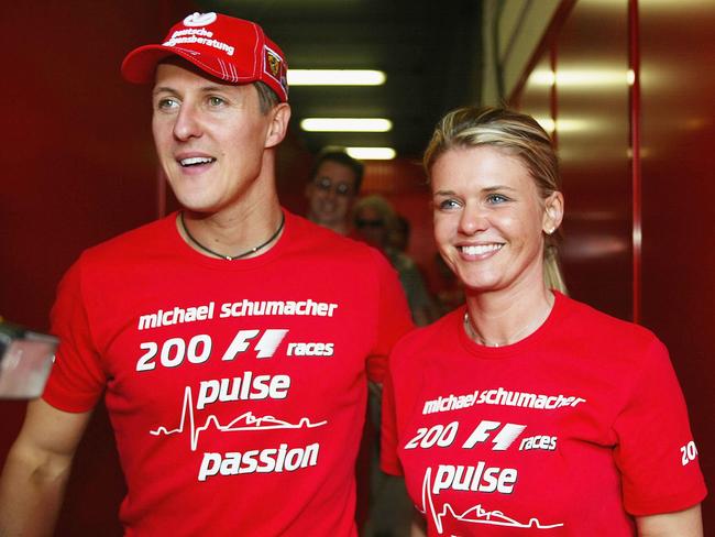 BARCELONA, SPAIN - MAY 9:  Michael Schumacher of Germany and Ferrari celebrates with his wife Corrina after competing in his 200th Grand Prix during the Spanish F1 Grand Prix on May 9, 2004, at the Circuit de Catalunya in Barcelona, Spain. (Photo by Getty Images)