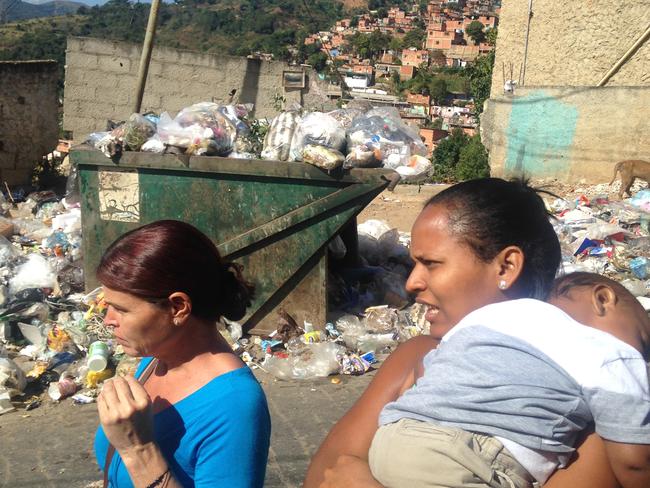 Life in the barrio. Food rations are so tight, some people need to rifle through garbage for food. Picture: Courtesy of the ABC