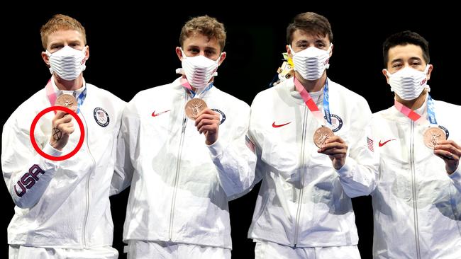 Race Imboden, left - CHIBA, JAPAN - AUGUST 01: Bronze medalists Team United States celebrate on the podium during the medal ceremony for the Men's Foil Team Team Fencing Gold Medal Match on day nine of the Tokyo 2020 Olympic Games at Makuhari Messe Hall on August 01, 2021 in Chiba, Japan. (Photo by Elsa/Getty Images)