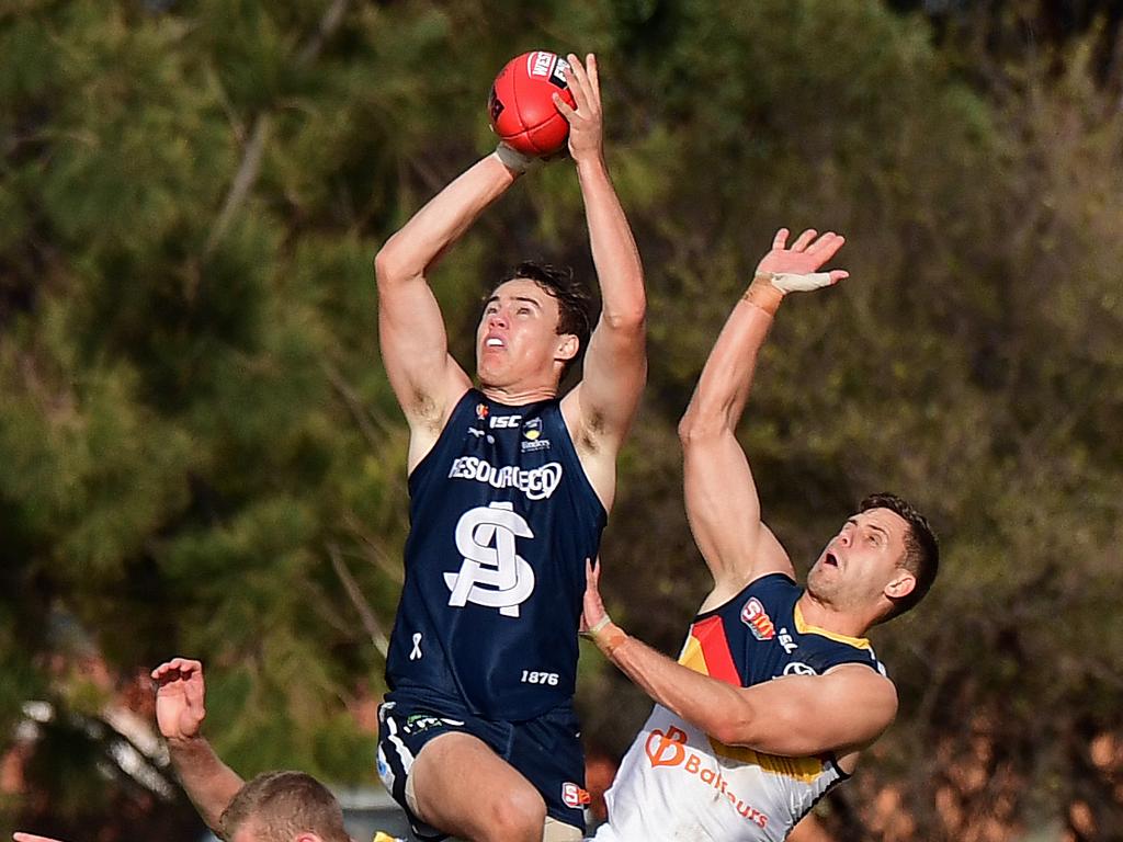 17/06/18 - South Adelaide v Adelaide Crows SANFL match at Hickinbotham Oval, Noarlunga.  South's Jackson Elmes takes a flying attempt at a mark. Picture: Tom Huntley