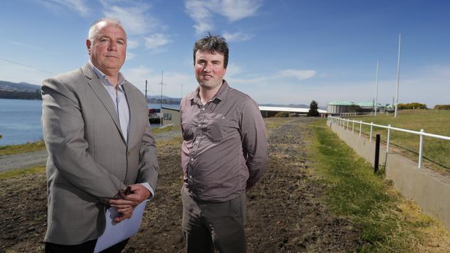Garney Pearce, left, and Ben Johnston, from the Hobart Northern Suburbs Rail Action Group, on the section of rail line that has been removed next to the Regatta grounds. Picture: RICHARD JUPE