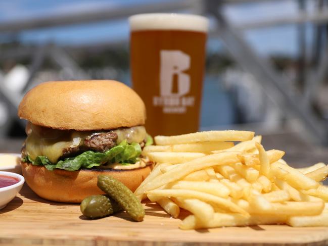 The wagyu burger, chips and Byron Bay Brewery beer. Picture: Jenifer Jagielski