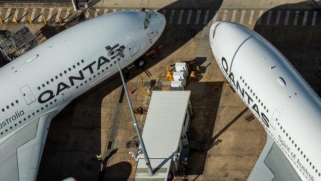 Qantas craft cool their jets early in the crisis at Sydney Airport, which Alan Joyce has accused of favouring foreign flyers over domestic carriers. Picture: Getty Images