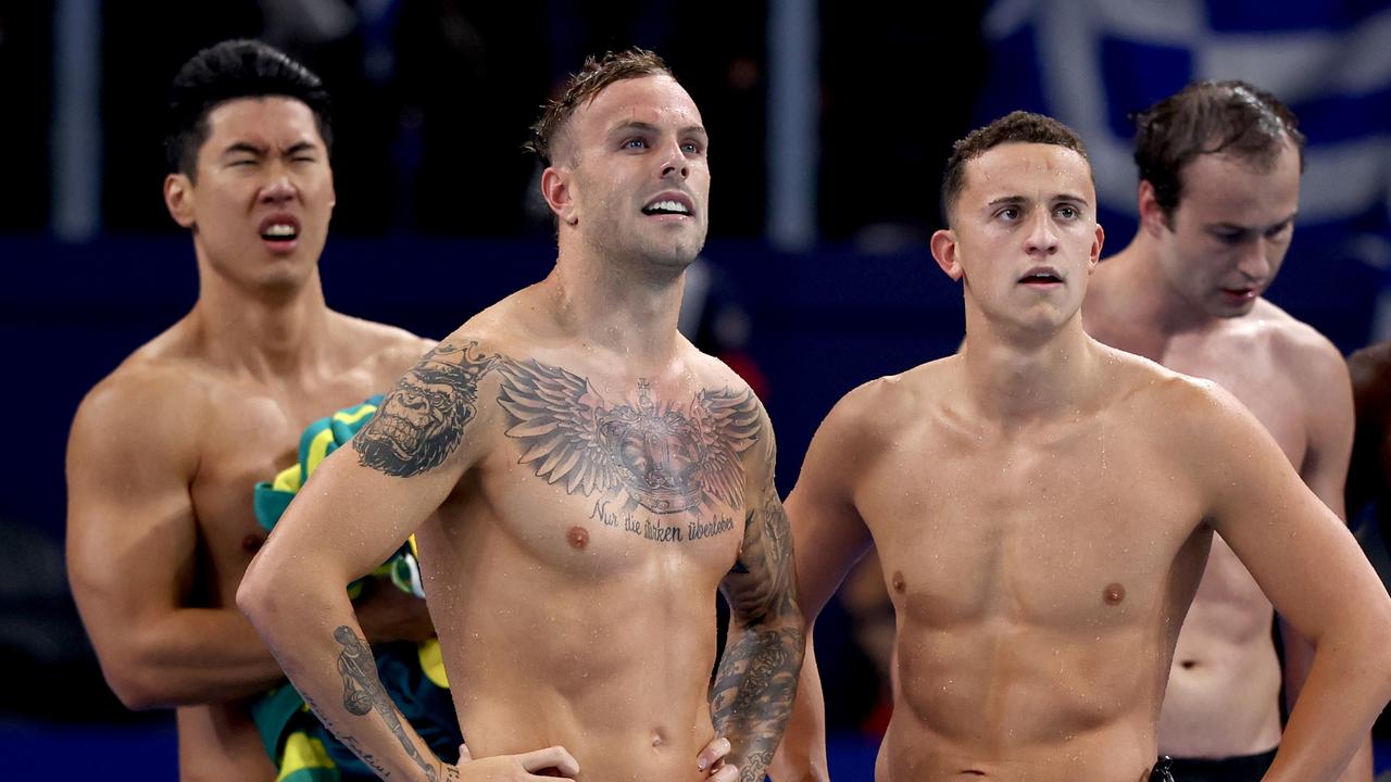 NANTERRE, FRANCE - JULY 27: Kyle Chalmers and Flynn Southam of Team Australia react after competing in the Men's 4x100m Freestyle Relay Heats on day one of the Olympic Games Paris 2024 at Paris La Defense Arena on July 27, 2024 in Nanterre, France. (Photo by Maddie Meyer/Getty Images)