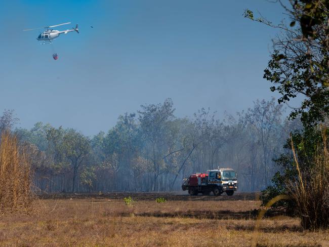 A bushfire ripped through the Livingstone area this afternoon, threatening local properties. Picture: Che Chorley