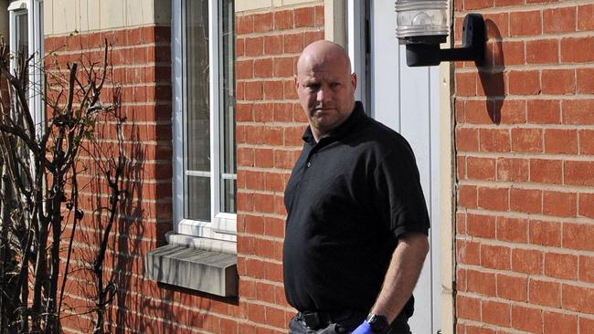 Police leave the house in Quayside where Khalid Masood lived, in Birmingham England. Picture: AP Photo