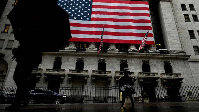 A woman walks past the New York Stock Exchange. Picture: AFP