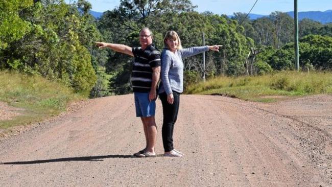 Lee and Colleen Wason on the road that cuts through their property, which was the central point on their recent appeal win against a Gympie Regional Council decision. Picture: Scott Kovacevic