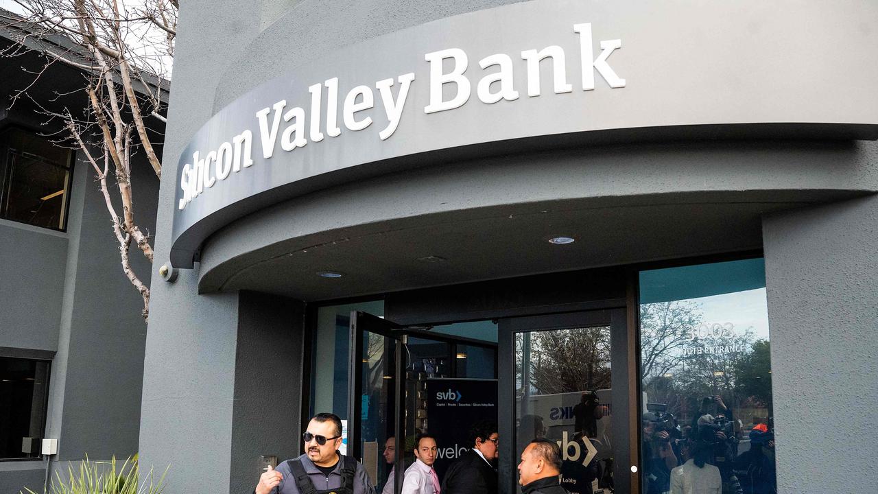 Security guards and FDIC representatives open a Silicon Valley Bank (SVB) branch for customers at SVB’s headquarters in Santa Clara, California, on March 13, 2023. Picture: Noah Berger /AFP