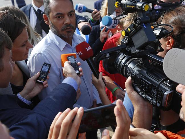 An unidentified family member is interviewed by members of the media about the release of the MH17 findings. Picture: AP/Peter Dejong