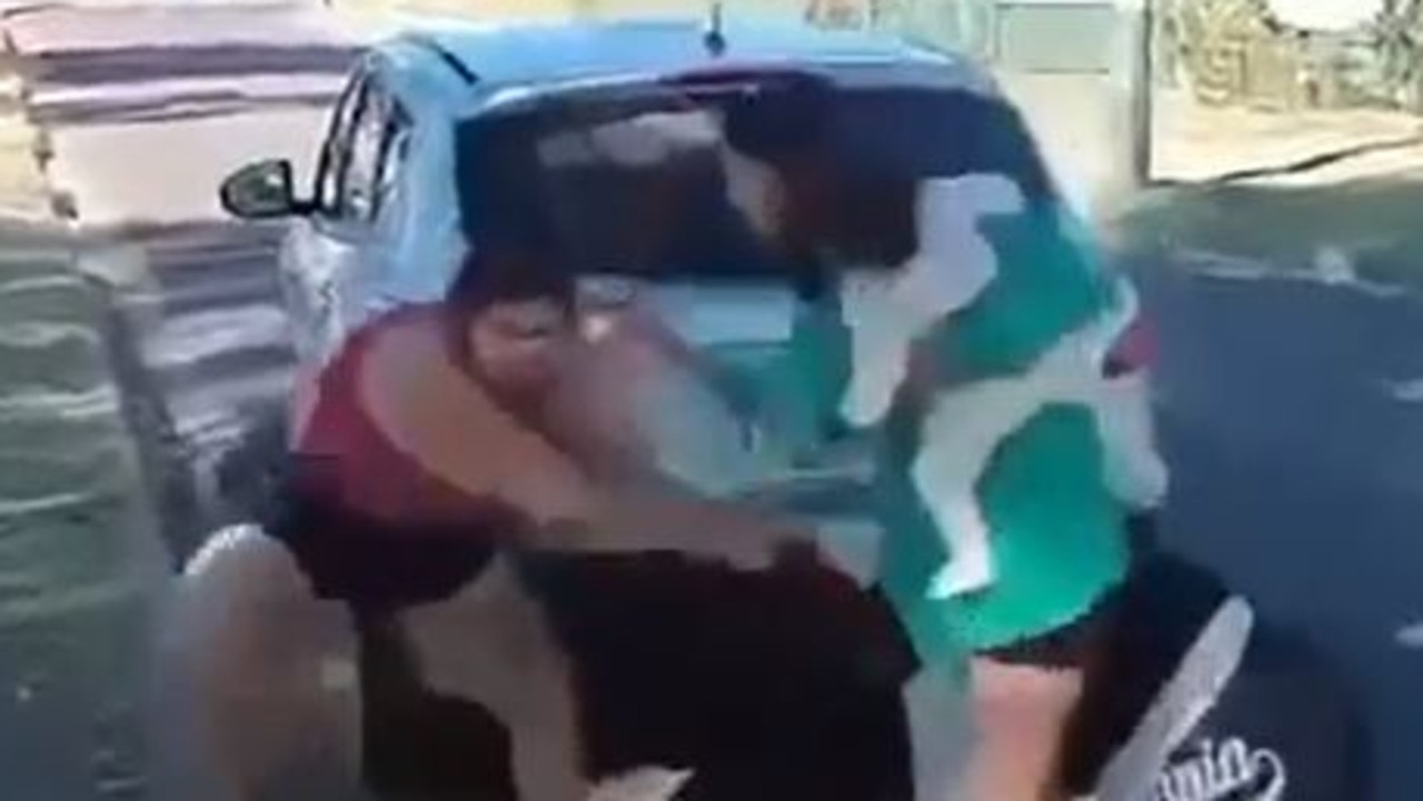 Watch: Woman’s wild act holding baby as chicks brawl in street