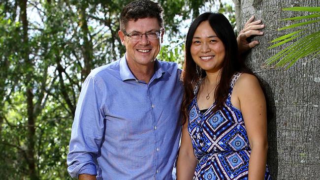 Rob Molhoek and his fiance Lucy Gu relax in the backyard of their home. Pic by David Clark