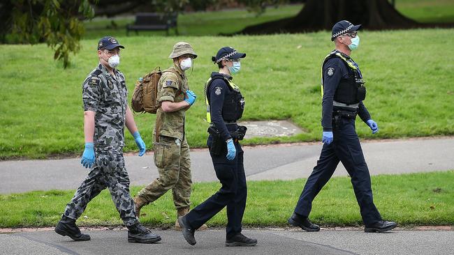 Defence Force personnel on patrol with police during Melbourne’s stage four lockdown. Picture: Ian Currie