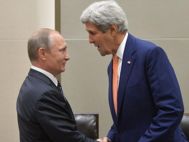 Russian President Vladimir Putin shakes hands with US Secretary of State John Kerry. Picture: Alexei Druzhinin.