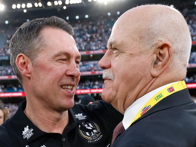 MELBOURNE, AUSTRALIA - SEPTEMBER 30: Craig McRae, Senior Coach of the Magpies is seen with Leigh Matthews during the 2023 AFL Grand Final match between the Collingwood Magpies and the Brisbane Lions at the Melbourne Cricket Ground on September 30, 2023 in Melbourne, Australia. (Photo by Dylan Burns/AFL Photos via Getty Images)