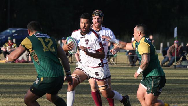 Round 16 Gold Coast District Rugby Union first grade game between Surfers Dolphins and Nerang Bulls. Nerang Player No 4 Tyran isaac Surfers Player No 12Fetongi Tuinauvai Pic Mike Batterham