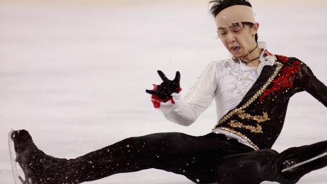 Yuzuru Hanyu of Japan falls in 2014 after havng sustained a concussion