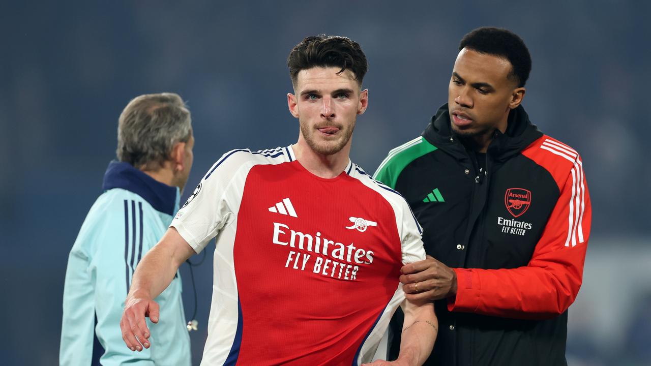 Declan Rice of Arsenal is consoled by teammate Gabriel at full-time following the loss to PSG. (Photo by Richard Heathcote/Getty Images)