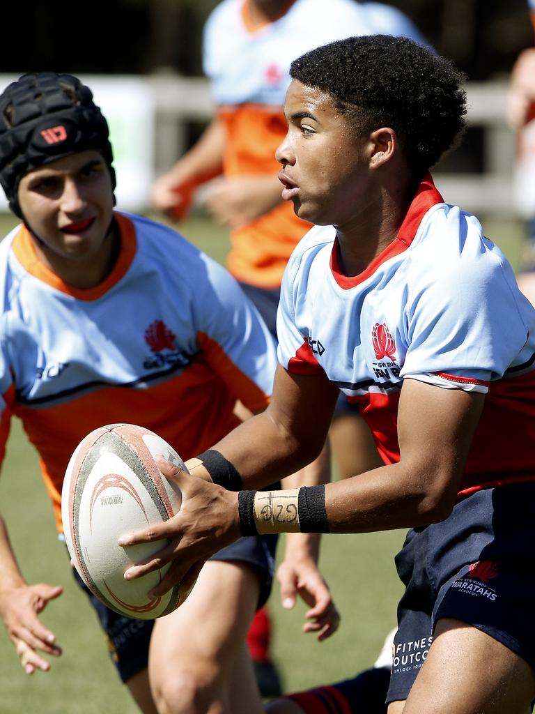 Saxon Gaw from U15 Baxter with the ball. U15 Baxter (Red) v U15 Gavin (Orange). Rugby Union Next Gen Cup for Under 15s and U14s. Picture: John Appleyard