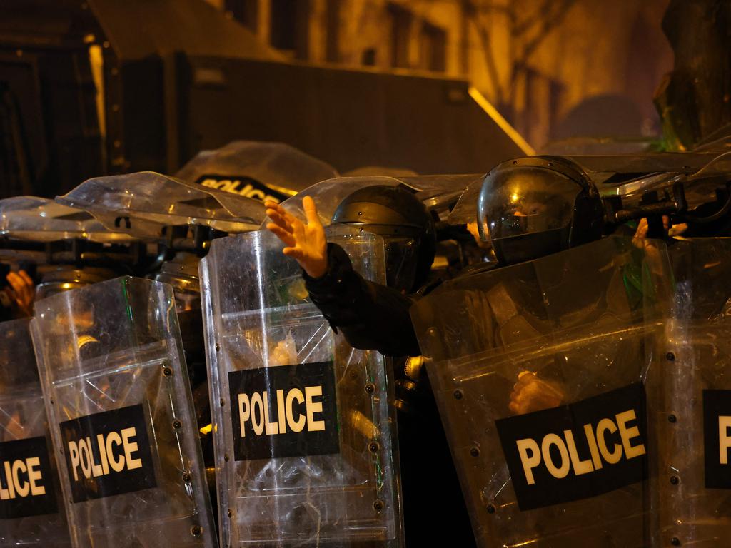 Police forces line up with shields in front of the crowds of demonstrators. Picture: Giorgi ARJEVANIDZE / AFP