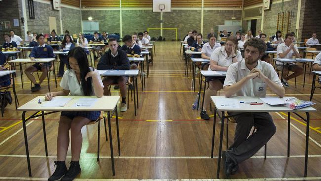 Liverpool Leader - Pictured: Students are given five minutes to read their English examination paper - Students at Holsworthy High School are sitting their HSC today. Holsworthy High is located on Huon Crescent, Holsworthy NSW Australia