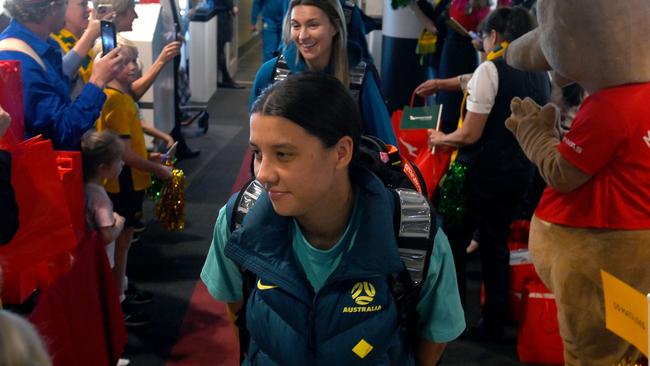 Sam Kerr of the Australia Matildas and team mates arrive in Brisbane following the team's loss to England in last night's FIFA Women's World Cup.