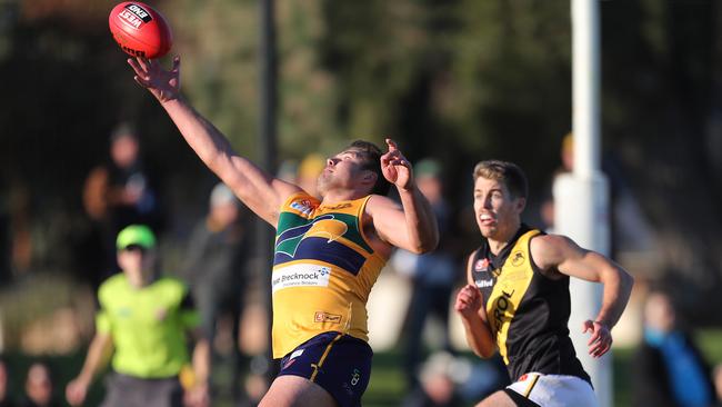 Eagle Michael Wundke stretches for a ball in his side’s win over Glenelg. Picture: Dean Martin