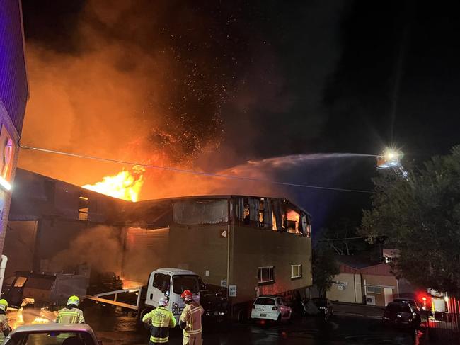 A warehouse fire which is expected to burn “for days” is being treated by police as suspicious.  Picture: FRNSW