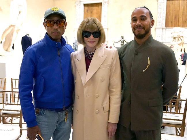 Pharrell Williams and Lewis Hamilton pose with Vogue editor Anna Wintour to announce the Met Gala theme. Picture: TIMOTHY A. CLARY/AFP